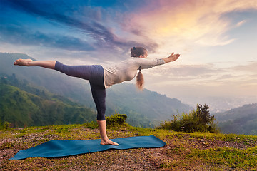 Image showing Woman doing Ashtanga Vinyasa Yoga asana Virabhadrasana 3 Warrior