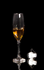 Image showing champagne glass with plastic corn