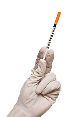 Image showing Hand holding syringe isolated on white