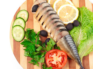 Image showing sliced herring on wooden plate