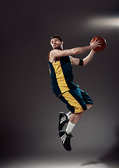 Image showing Full length portrait of a basketball player with ball