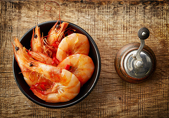 Image showing roasted prawns on wooden cutting board