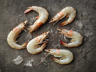 Image showing fresh raw prawns on dark gray kitchen table