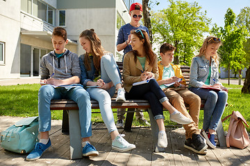 Image showing group of students with notebooks at school yard