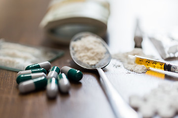 Image showing close up of drugs, money, spoon and syringe