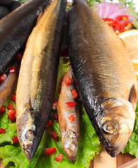 Image showing fish on plate with red pepper