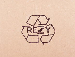 Image showing torn out piece of cardboard with recycle symbol