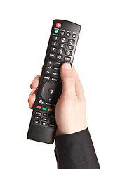 Image showing Hand with TV remote control isolated