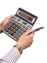 Image showing Male businessman using a calculator