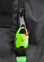 Image showing Green lock on a bag\'s zipper