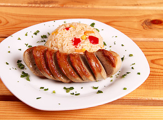 Image showing fried rice with vegetables and cut sausage