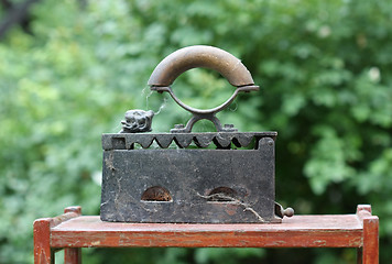 Image showing Retro iron on wooden stand