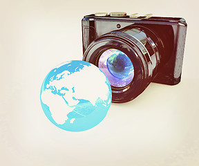 Image showing 3d illustration of photographic camera and Earth