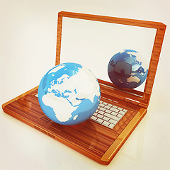 Image showing Eco Wooden Laptop and Earth. 3D illustration. Vintage style.