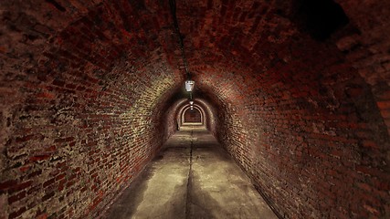 Image showing Long underground brick tunnel angle shot