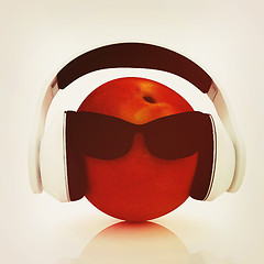 Image showing fresh peaches with sun glass and headphones front \