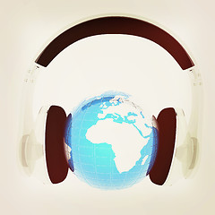 Image showing Blue earth with headphones from transparent plastic. World music