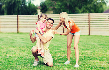 Image showing happy family hugging outdoors