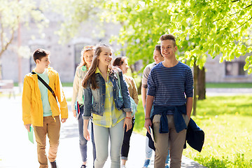 Image showing group of happy teenage students walking outdoors