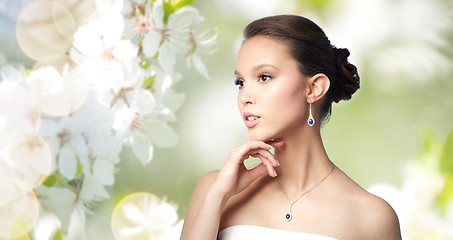 Image showing beautiful asian woman with earring and pendant