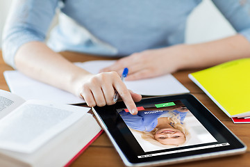 Image showing close up of woman with incoming call on tablet pc