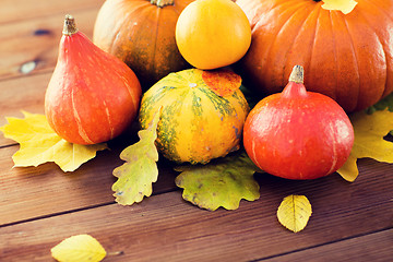 Image showing close up of pumpkins on wooden table at home