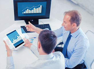 Image showing businessmen with tablet pc and computer at office