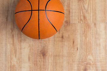 Image showing close up of basketball ball on wooden floor