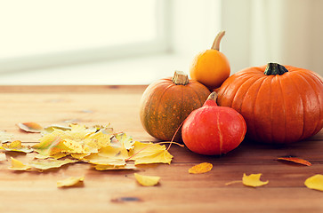 Image showing close up of pumpkins on wooden table at home