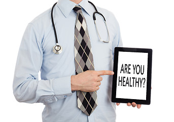 Image showing Doctor holding tablet - Are you healthy?