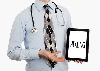 Image showing Doctor holding tablet - Healing