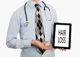 Image showing Doctor holding tablet - Hair loss