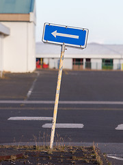 Image showing Traffic sign arrow pointing left, sign on an abandoned Amarican 