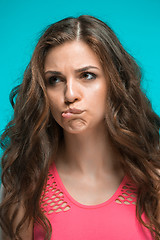 Image showing The young woman\'s portrait with thoughtful emotions