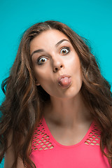 Image showing The young woman\'s portrait with happy emotions