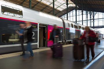 Image showing People coming to or leaving train station platform.