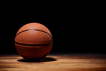 Image showing Basketball on a hardwood court floor