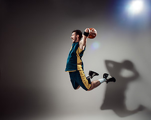 Image showing Full length portrait of a basketball player with ball