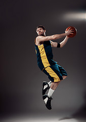 Image showing Full length portrait of a basketball player with ball