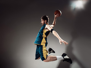 Image showing Full length portrait of a basketball player with ball