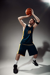 Image showing Full length portrait of a basketball player with ball