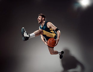 Image showing Full length portrait of a basketball player with ball