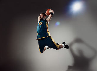 Image showing Full length portrait of a basketball player with ball