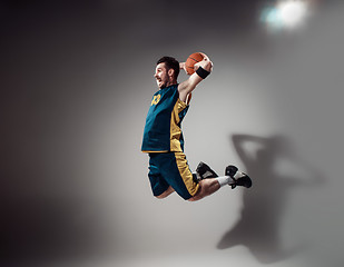 Image showing Full length portrait of a basketball player with ball