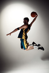 Image showing Full length portrait of a basketball player with ball