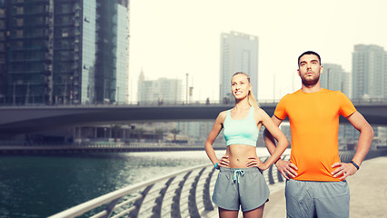 Image showing couple exercising over dubai city street 