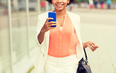 Image showing close up of african woman with smartphone in city