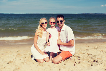 Image showing happy family in sunglasses on summer beach