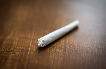 Image showing close up of marijuana joint or handmade cigarette
