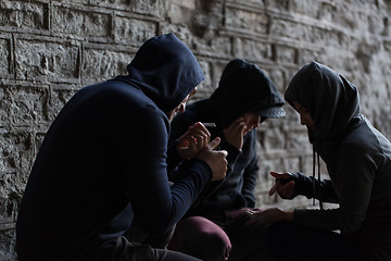 Image showing close up of young people smoking cigarettes